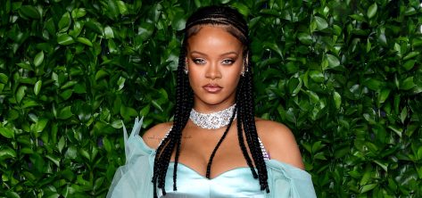 Rihanna in Yellow Knit Bikini Top Poses for Rimowa