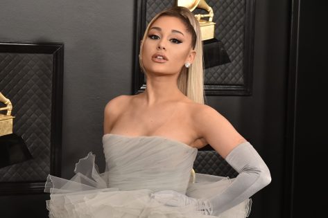 Ariana Grande in Bikini Top Celebrates New Makeup Line