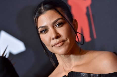 Kourtney Kardashian in Retro Swimsuit Looks “Rad” on Bike