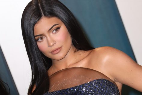 Kylie Jenner Shows Off Baby Bump in Sheer Lace Catsuit