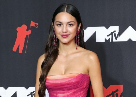 Olivia Rodrigo is All Wet Wearing Dress in Pool