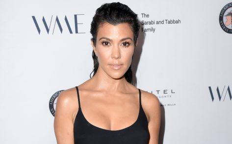 Kourtney Kardashian Flaunts Curves in Swimsuit and Cowboy Boots