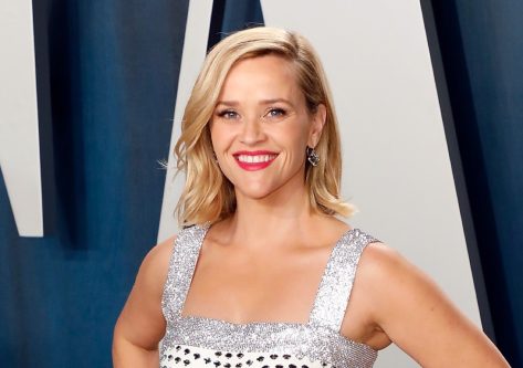 Reese Witherspoon in Beachwear is “Chasing the Sunshine”