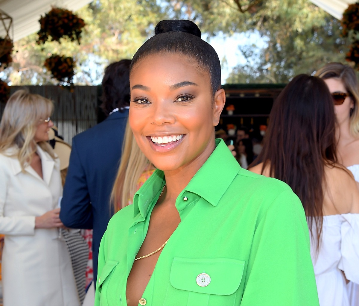 Gabrielle Union in Bathing Suit Lounges on Golf Course — Celebwell