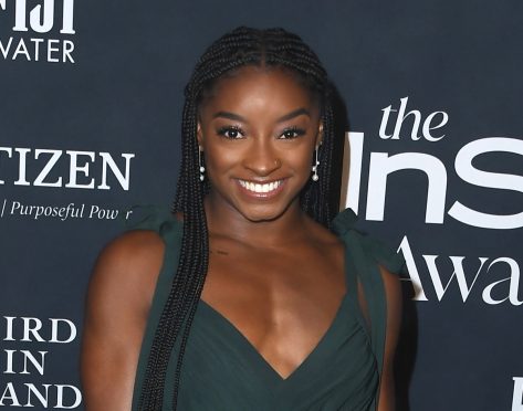 Simone Biles in Bathing Suit “Never Met a Beach I Didn’t Like”