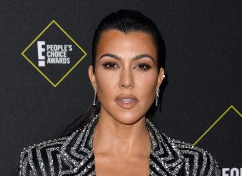 Kourtney Kardashian in Bathing Suit Sunbathes After Workout