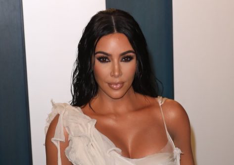 Kim Kardashian in Bathing Suit Has “Beach Party”
