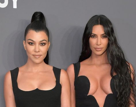 Kim and Kourtney Kardashian in Bathing Suits Share Workout