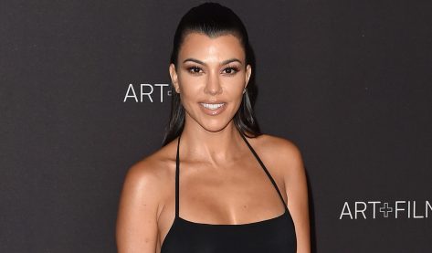 Kourtney Kardashian in Bathing Suit Talks “Bikini Abs”