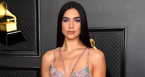 Dua Lipa in Bathing Suit “Loves the World”