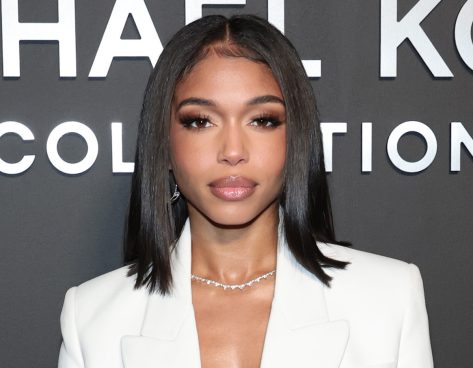 Lori Harvey in Bathing Suit Wears “Sunnies” Poolside 