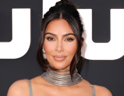 Kim Kardashian in Bathing Suit Says “Aloha”