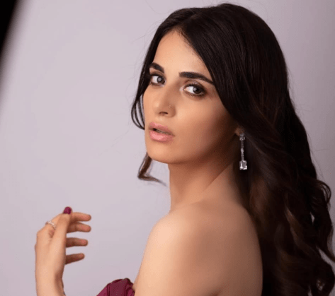 Radhika Madan in Bathing Suit is “Just Pooling Around”