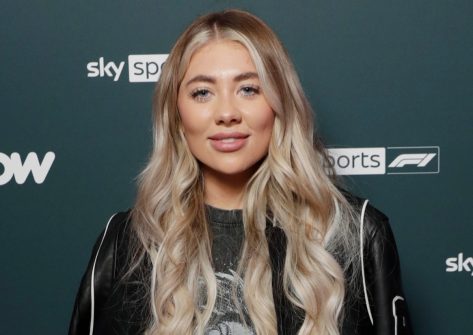 Paige Turley in Bathing Suit Top Says “Until Next Year IBZ”