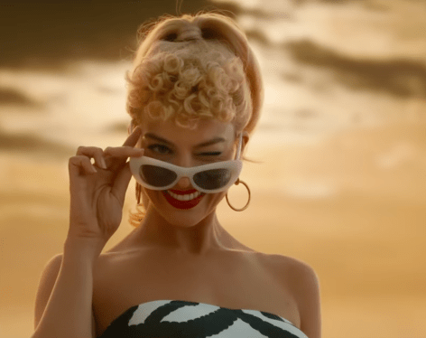 Margot Robbie in Bathing Suit Shares First Look at “Barbie”