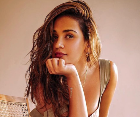 Aisha Sharma in Bathing Suit is “Tanning”