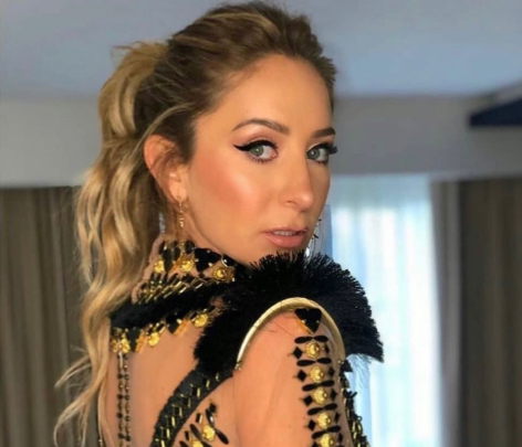 Geraldine Bazán in Bathing Suit is a “Colorful Castaway”