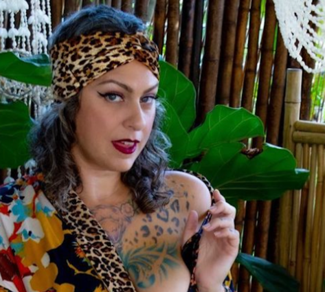 Danielle Colby in Bathing Suit Says "Cheers"