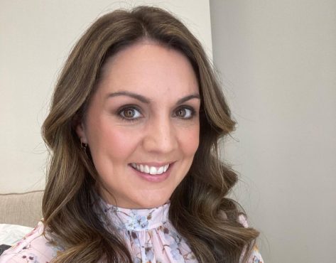 Laura Tobin in Bathing Suit is “Working on the Tan”