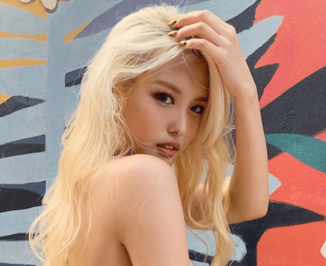 Ahin in Bathing Suit Asks “Too Much Red?”