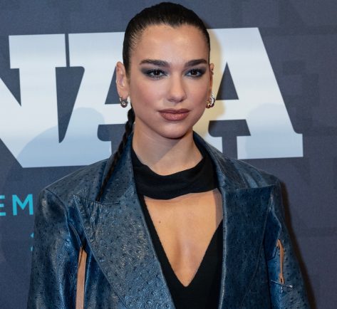 Dua Lipa Shares Swimsuit Photo Asking “Is it Better Here or There?”