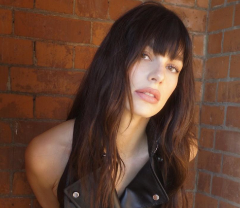 Camila Morrone Shares Swimsuit Photos “Looking Back”