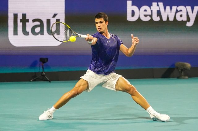 MIAMI GARDENS, FLORIDA - APRIL 1, 2022: Professional tennis player Carlos Alcaraz of Spain in action during his semifinal match at 2022 Miami Open at the Hard Rock Stadium in Miami Gardens, Florida