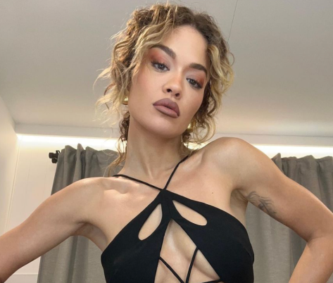 Rita Ora Shares Swimsuit Photo “Playing it All Back”