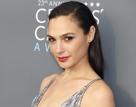 Gal Gadot Shares Swimsuit Photo "Spending Time in the Sun"