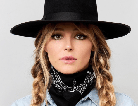 Yellowstone Star Hassie Harrison Shares Swimsuit Photo From “the Beach”