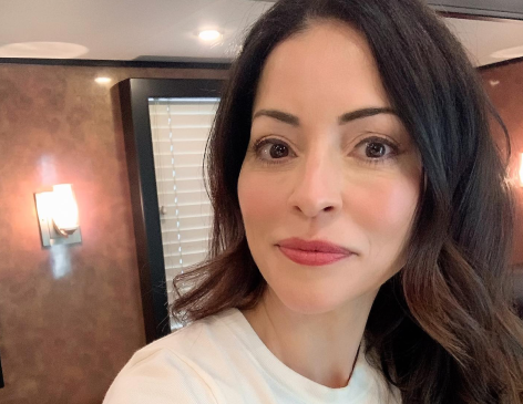 Two and a Half Men Star Emmanuelle Vaugier Shares Swimsuit Photo "Poolside"