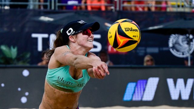 CHICAGO, ILLINOIS - SEPTEMBER 03: Kristen Nuss digs the volleyball against Terese Cannon and Sarah Sponcil during the AVP Gold Series Chicago Open at Pomellato’s Oak Street Boutique on September 03, 2022 in Chicago, Illinois. (Photo by Quinn Harris/Getty Images)