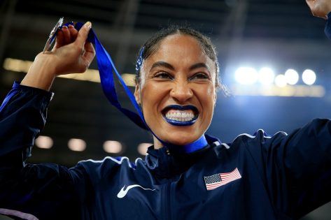 Track and Field Athlete Queen Harrison in Two-Piece Workout Gear Says "Get on the Track"