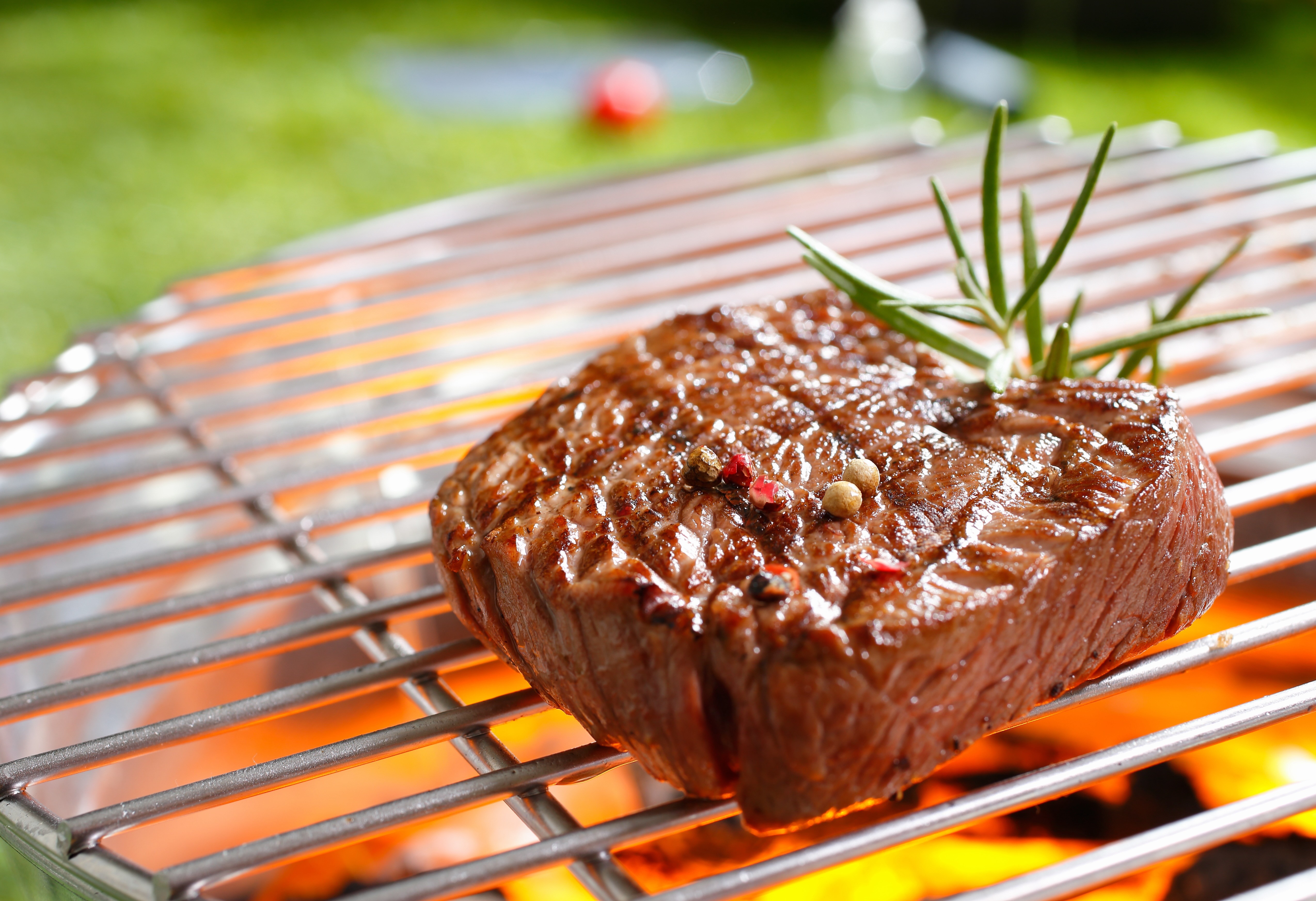 A juicy steak on the grill.