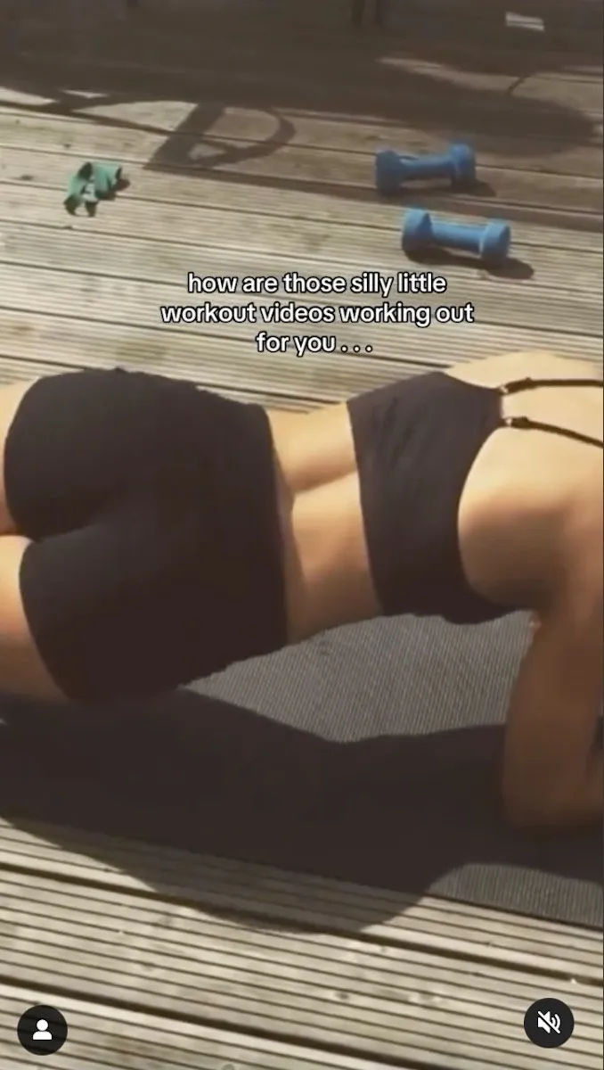 Stefanie Williams is seen doing a variation of a plank.