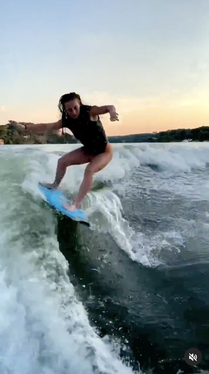 Demi Bagby catches waves.