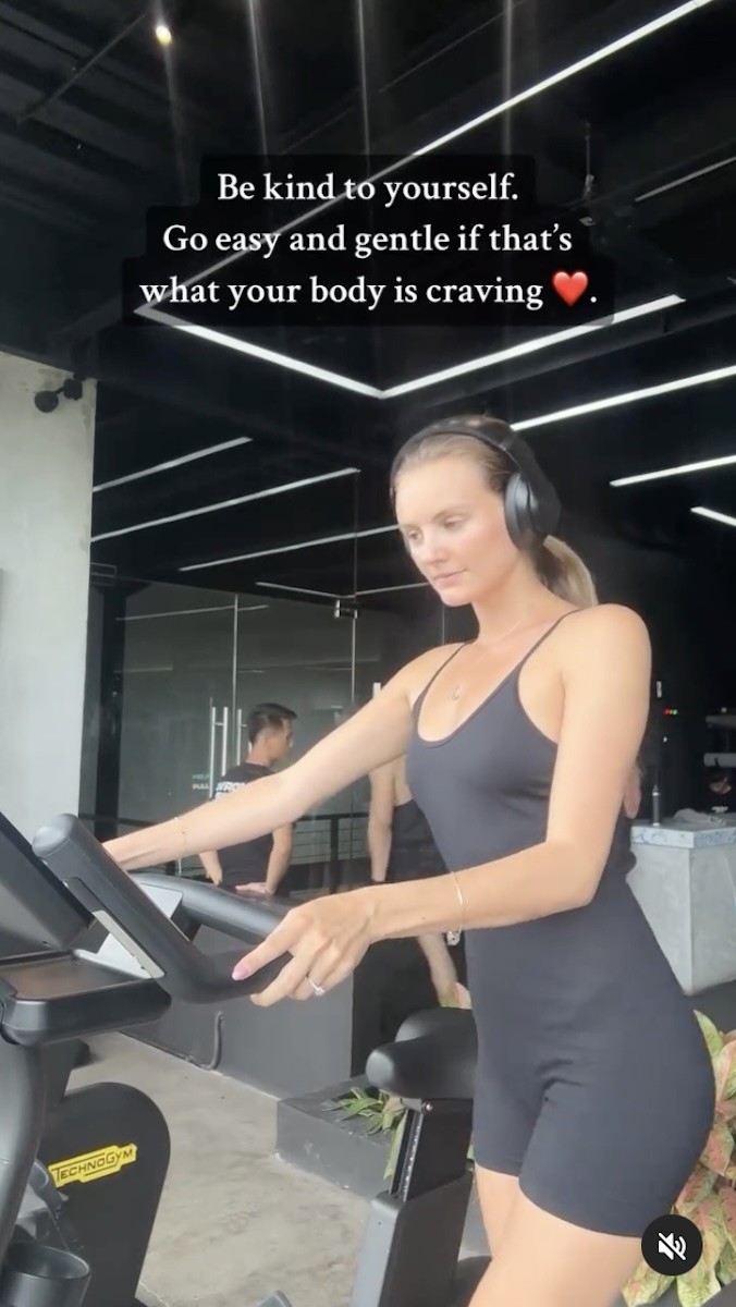 Nikki Smart is seen using a stationary bike.