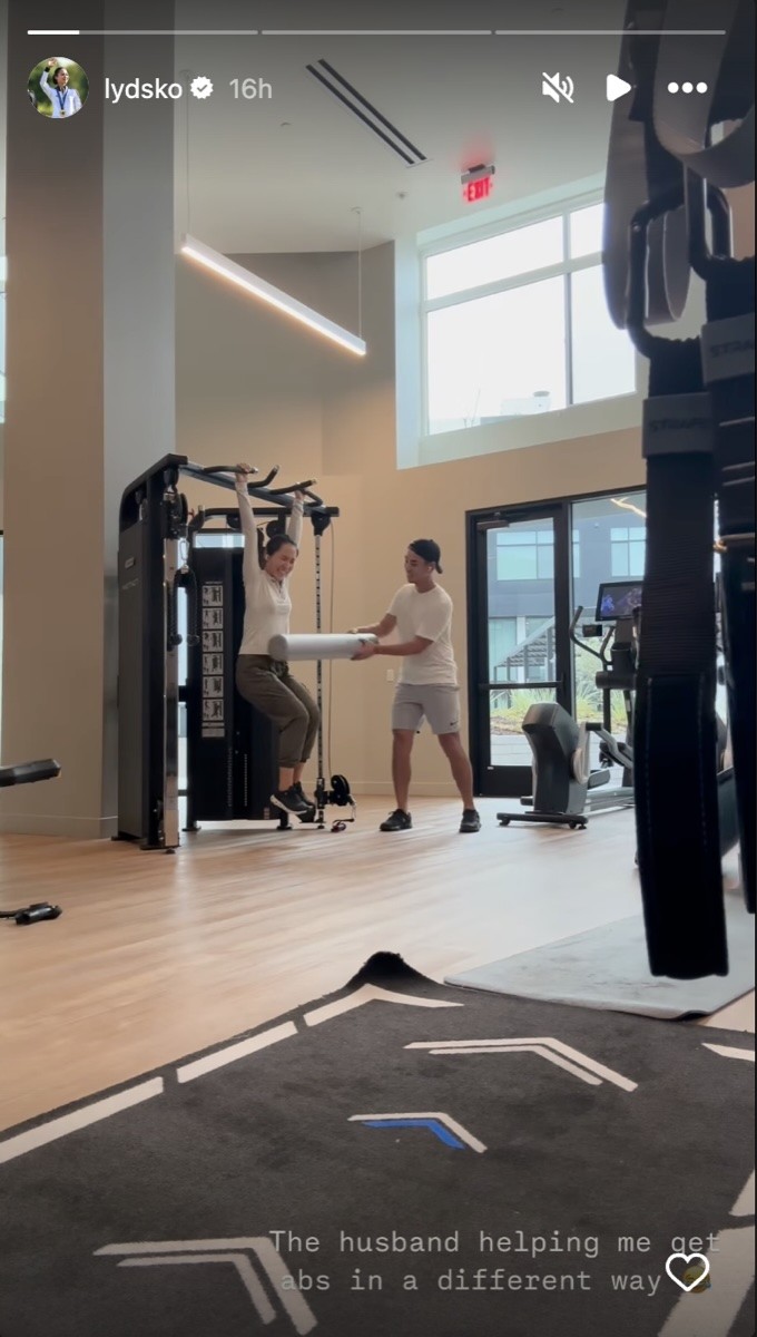 Lydio Ko gets some help from her husband while working out.