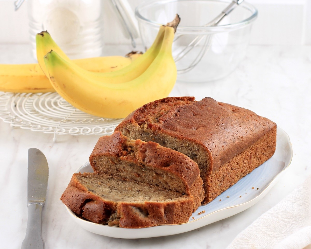 Banana Bread Sliced on White Table.