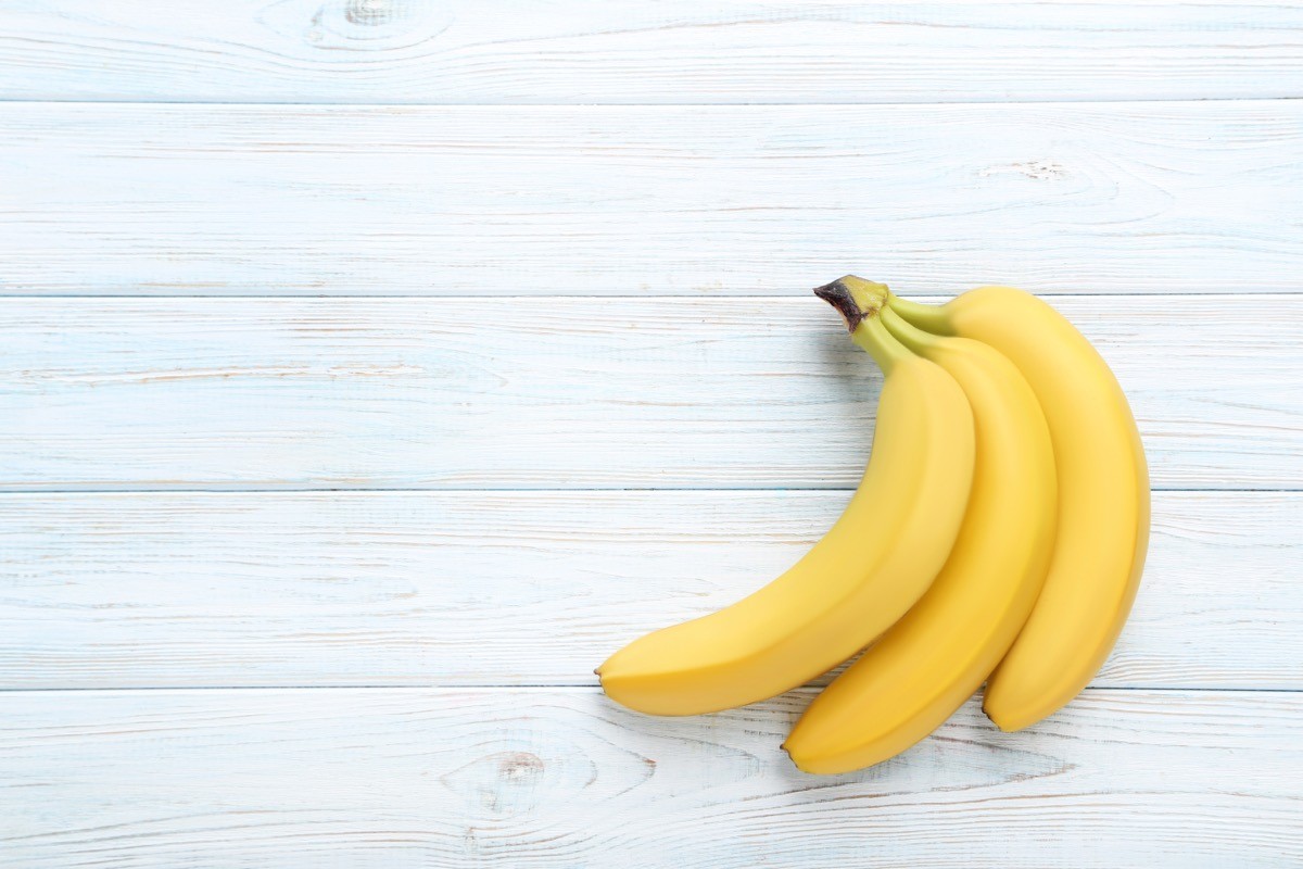 Sweet,Bananas,On,White,Wooden,Table