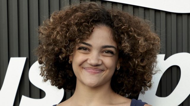 Gymnast Laurie Hernandez Shows Off Six-Pack Abs Under Waterfall During "Happy Holidays"