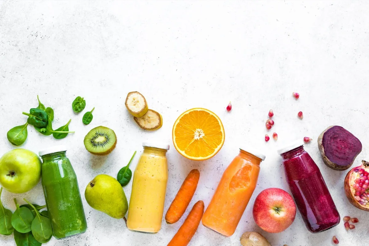 Various,Smoothies,Or,Juices,In,Bottles,And,Ingredients,On,White,