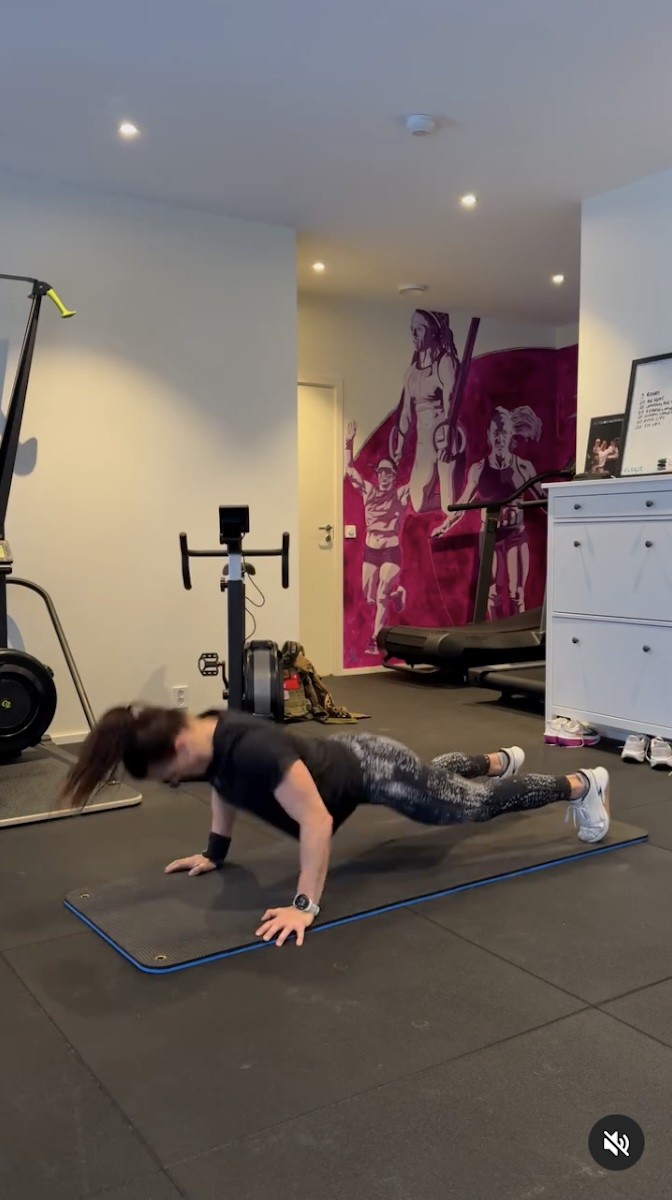 Kristin Holte is pictured doing a set of push-ups.