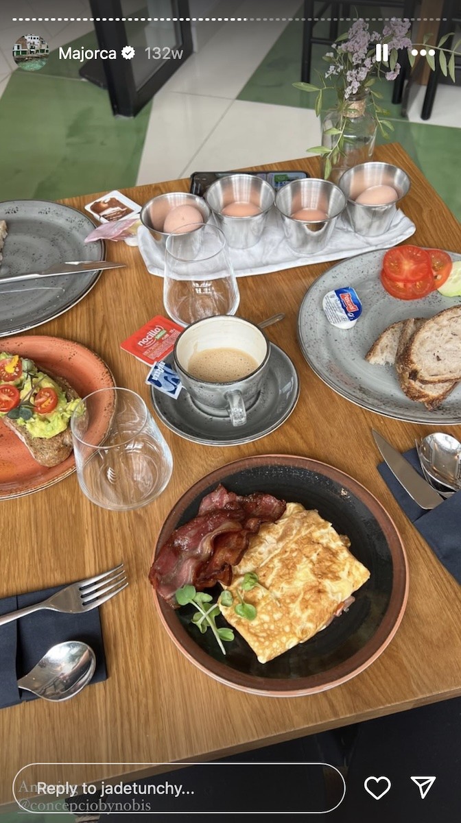 Table full of breakfast foods.