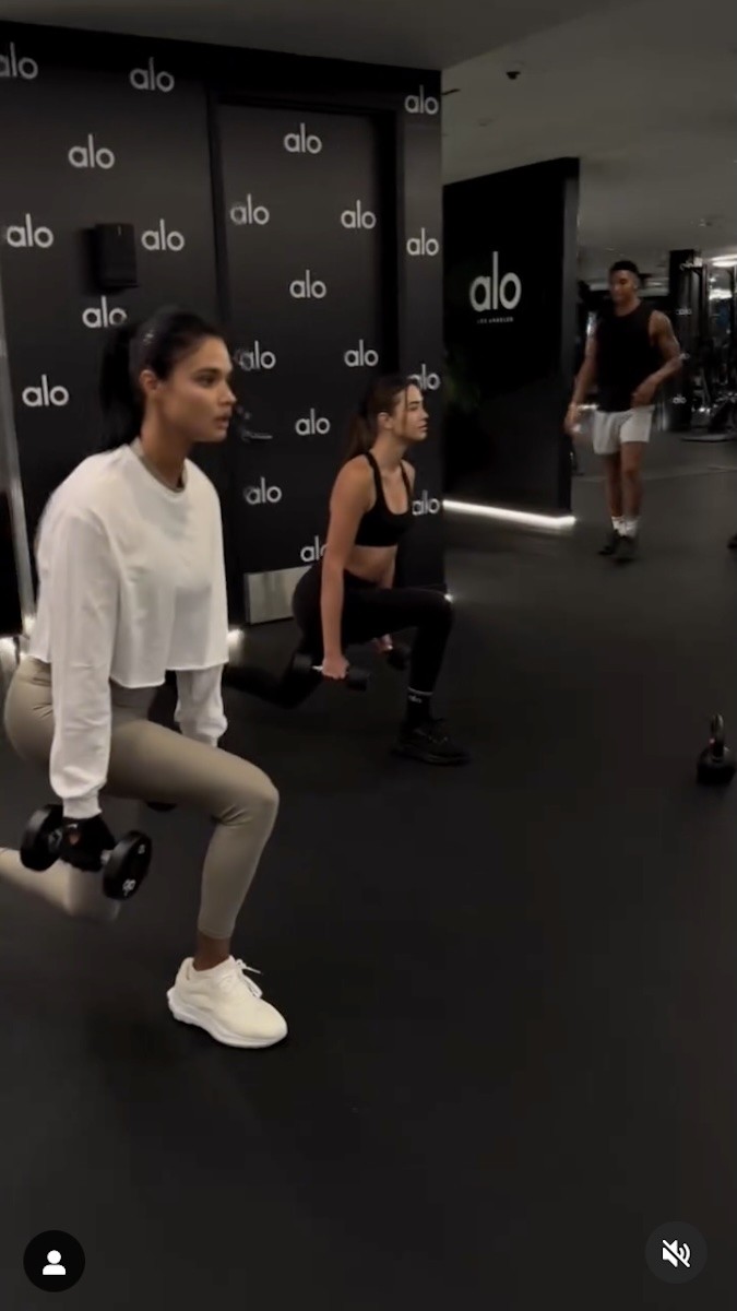 Daniela Braga does lunges with a friend.