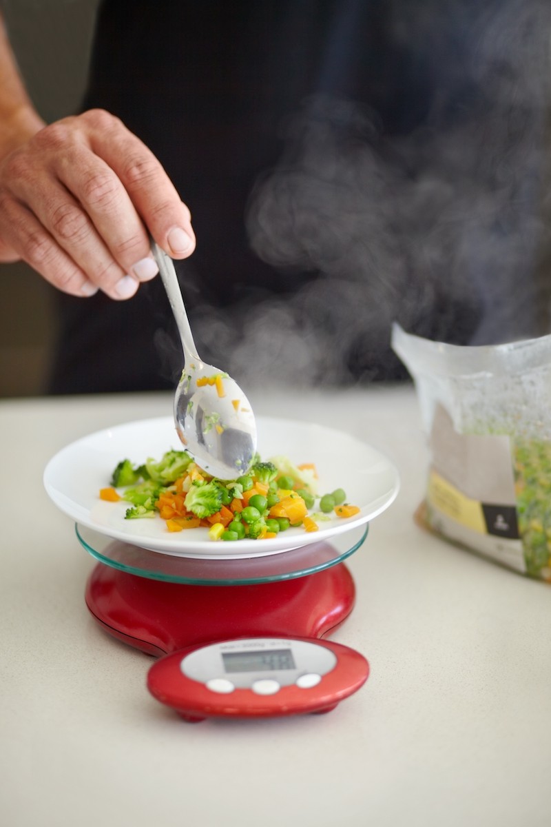 Scale,,Food,And,Man,With,Vegetables,In,Kitchen,To,Measure