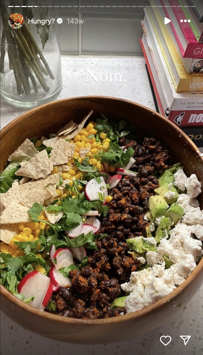 Salad with cheese, beans, corn, avocado, radish, greens