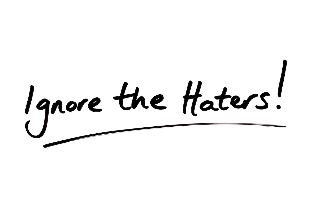 Ignore,The,Haters!,Handwritten,On,A,White,Background.