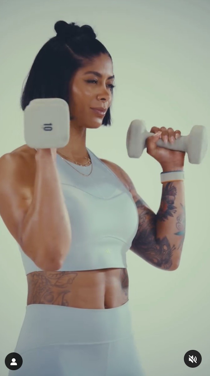 Massy Arias is seen lifting weights.