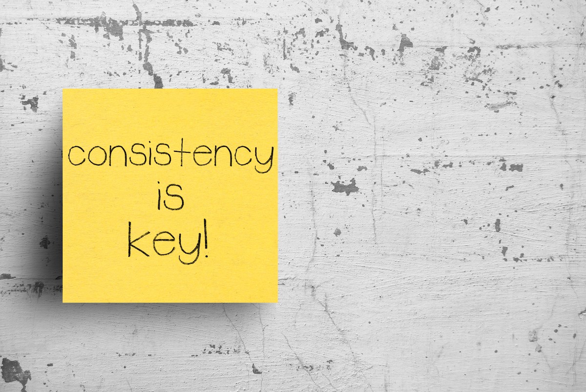 Sticky,Note,On,Concrete,Wall,,Consistency,Is,Key